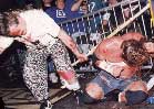 Raven battling Sandman in an ECW barbed wire match