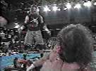 Raven confronting a bloody Terry Funk